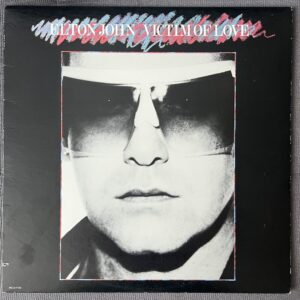 Home 1 Elton John - Victim of Love